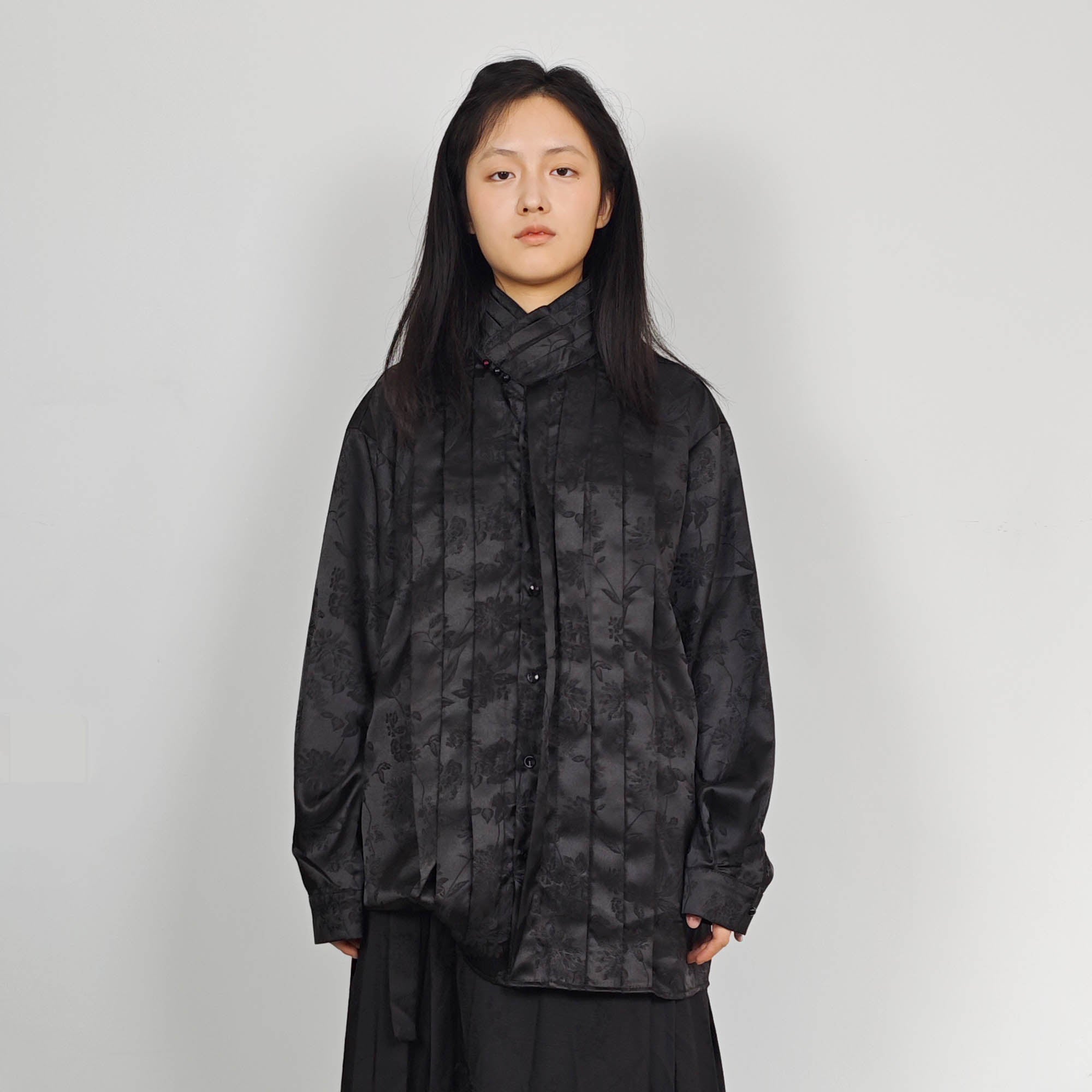 High collar black shirt pleated front details black monochrome jacquard fabric