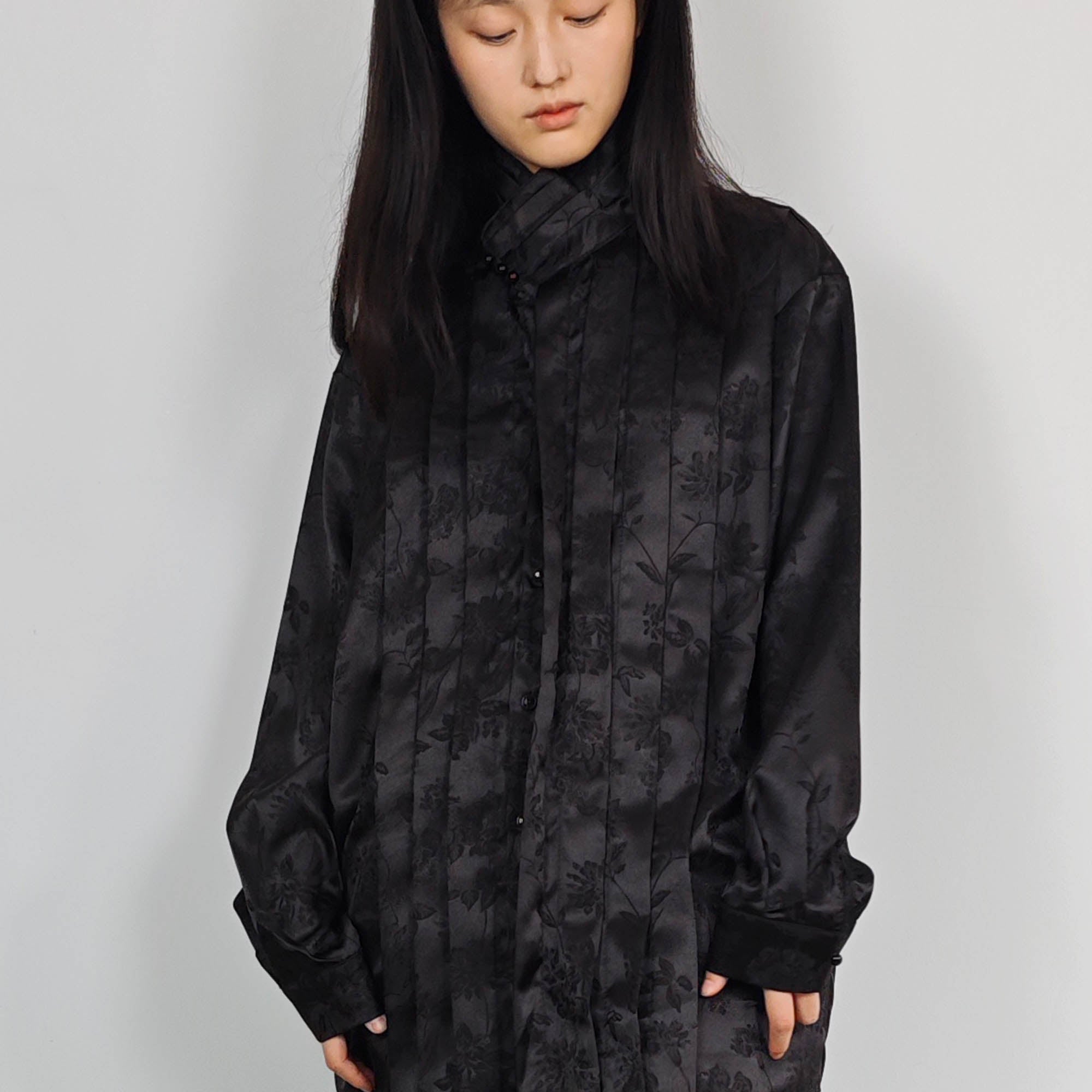 High collar black shirt pleated front details black monochrome jacquard fabric