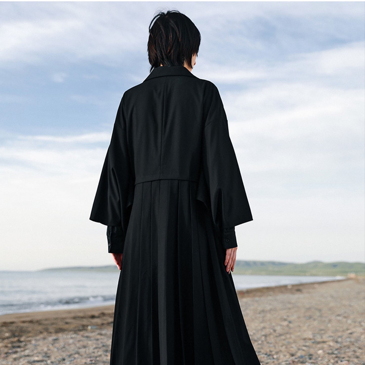 Suit dress with squared sleeves and pleated skirt Black suiting fabric dress
