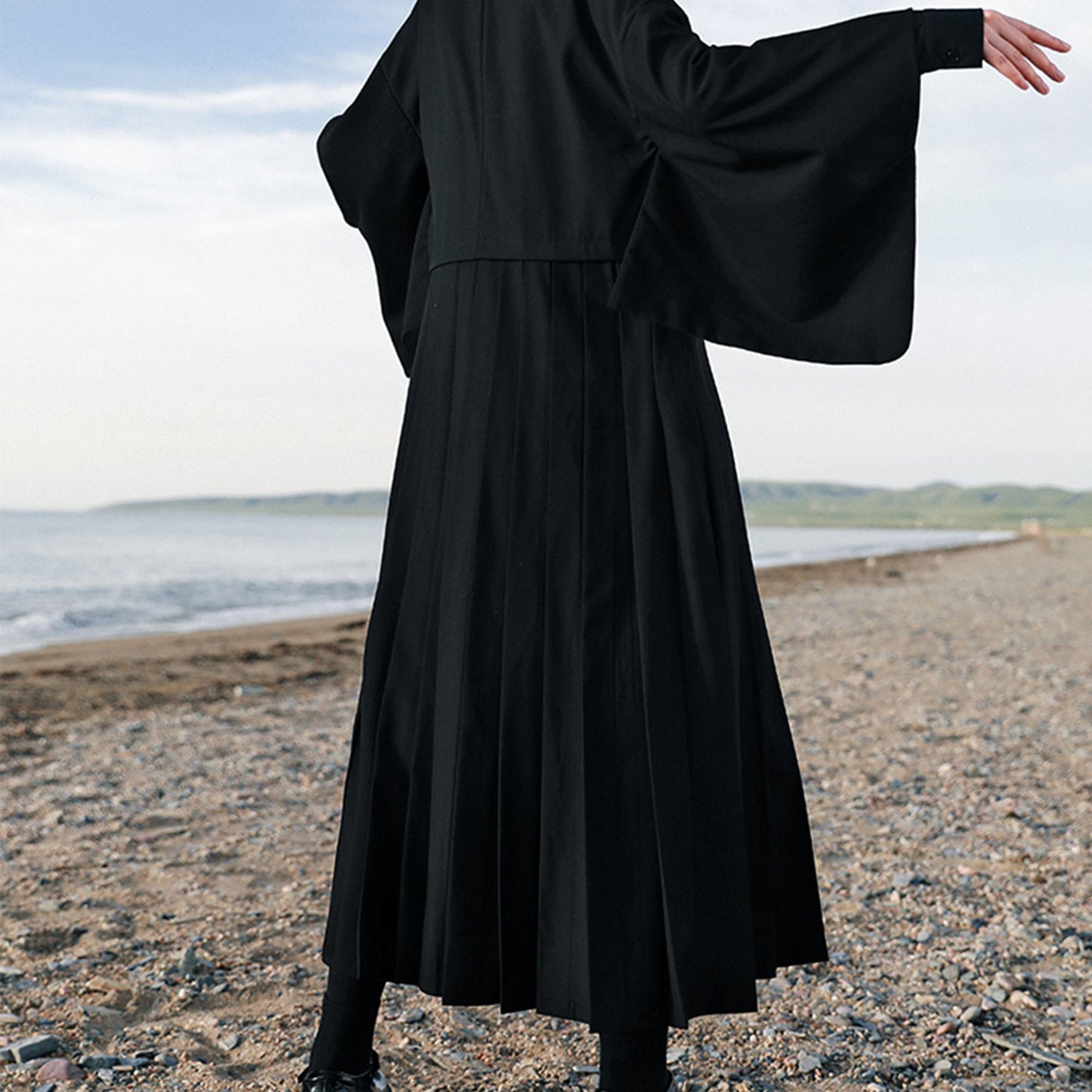 Suit dress with squared sleeves and pleated skirt Black suiting fabric dress