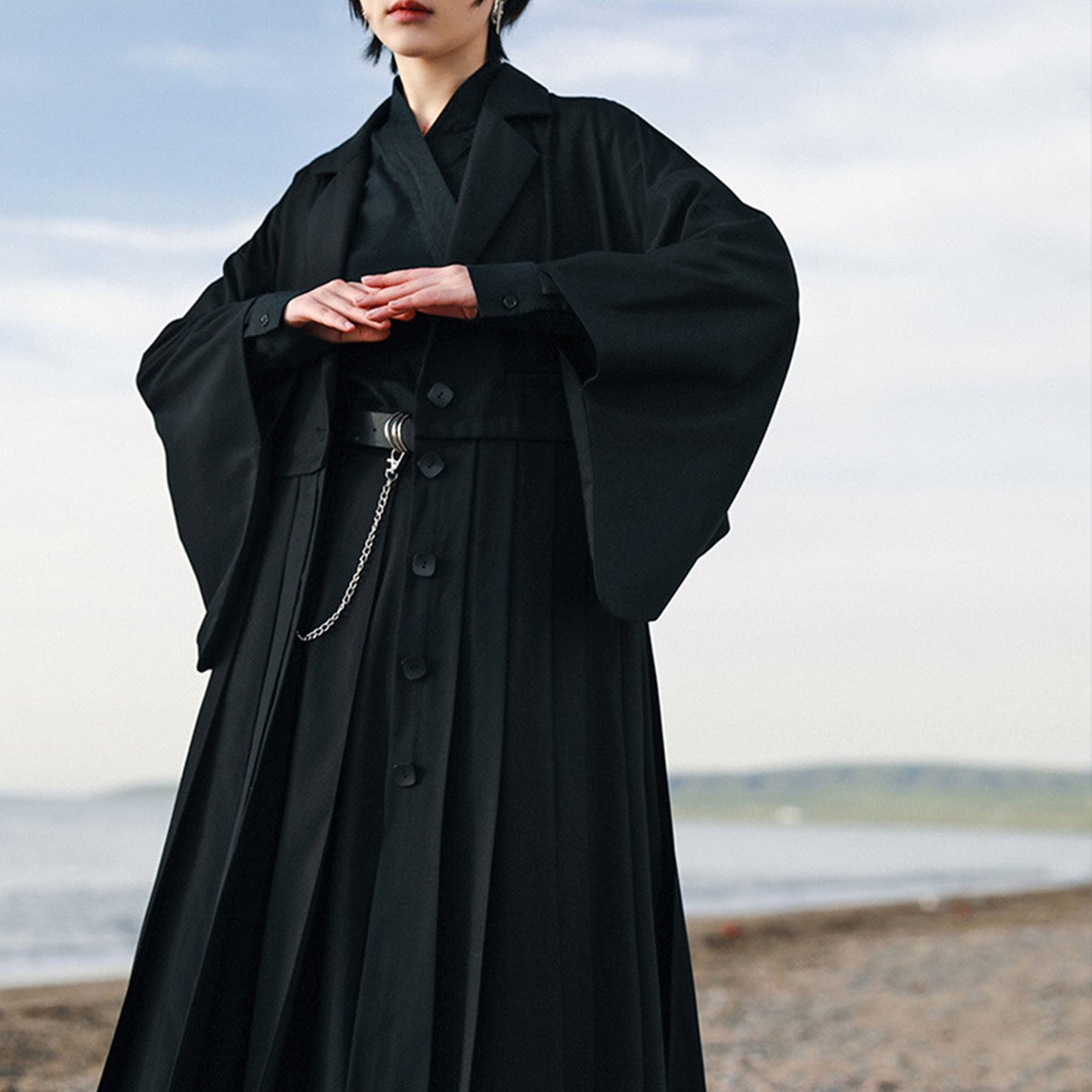 Suit dress with squared sleeves and pleated skirt Black suiting fabric dress
